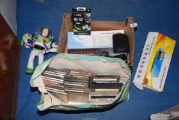 A quantity of miscellanea including; CD's, Buzz Lightyear toy, vehicle black box, etc.