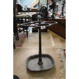 A cast iron four section Stick/Umbrella Stand, 28'' tall.