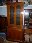 A circa 1900 Satinwood Bookcase on Cupboard,