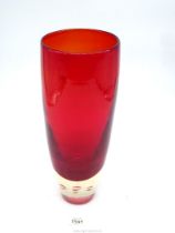 A very heavy red tapered Art Glass vase with deep clear concave base containing four floating