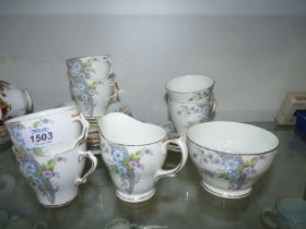 A Windsor bone china Teaset for six (no teapot) in mauve and blue floral pattern.