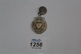 A silver Medallion, Birmingham 1913, maker William James Dingley, plus a Victorian silver 3d bit.
