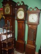 A Mahogany cased Longcase Clock having an arched door and mirrored swan-neck pediment,