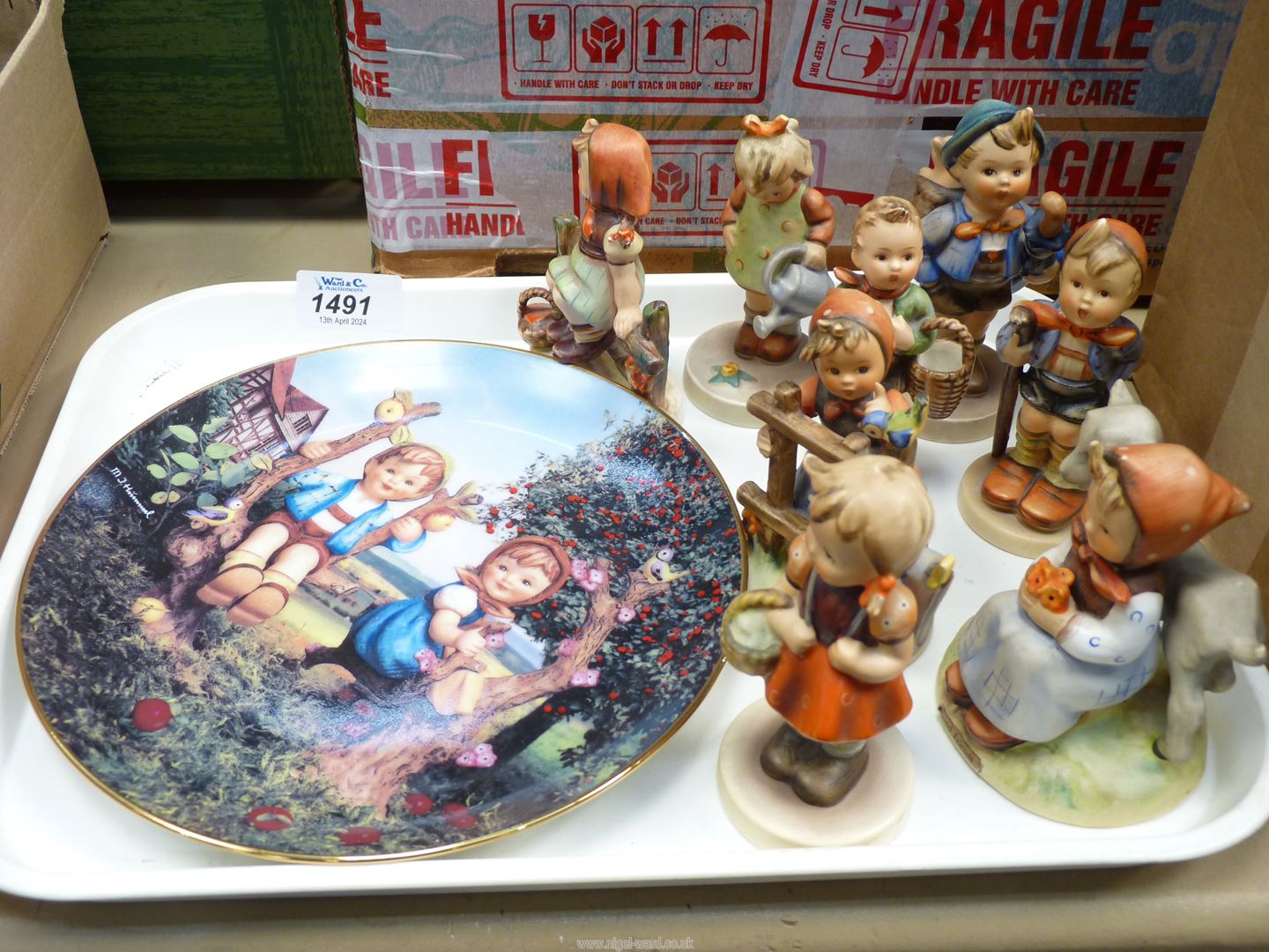 Eight Hummel figures including; 'Signs of Spring', 'Home from Market', 'Little Gardener', etc.