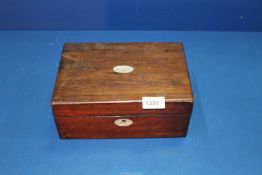 A mahogany box having Mother of Pearl escutcheons, label inside '128 Long Acre, London, w.c.
