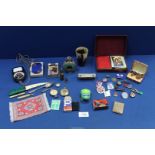 A quantity of miscellanea including a horn beaker, playing cards, compass, matchbox, lighters, etc.
