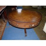 A nice quality low Mahogany Drum Table having an inset brown leather top with gold tooling,