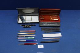 A quantity of Parker pens including; one with 18k gold nib, Papermate, rolled gold Biro, etc.