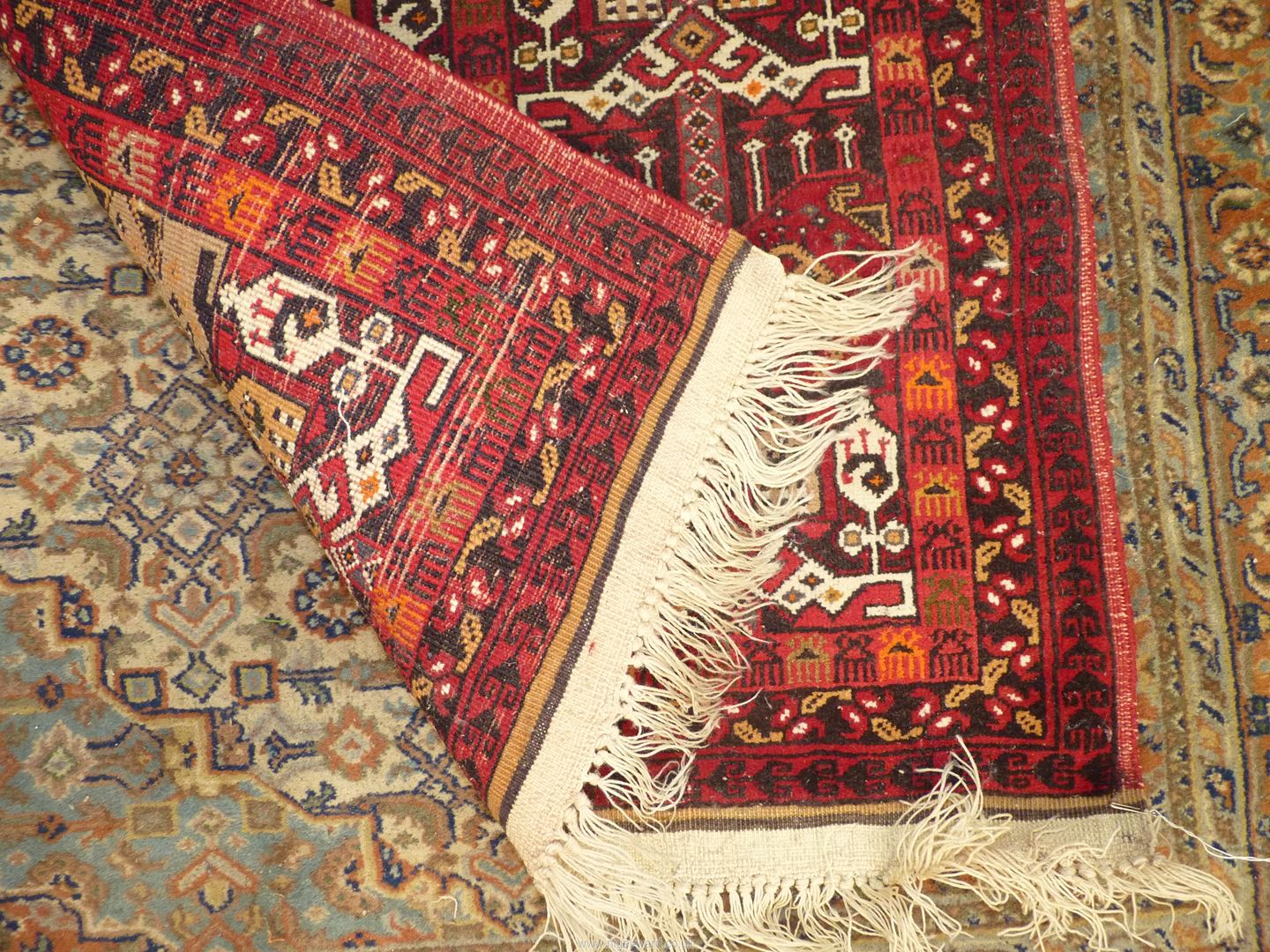 A border pattern and fringed Afghan tribal rug in bright and warm shades of terracotta, 58'' x 29''. - Image 3 of 3