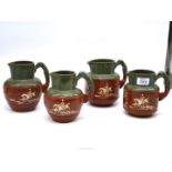 Four green and brown Langley ware horse and hound stoneware Jugs, circa 1930's.