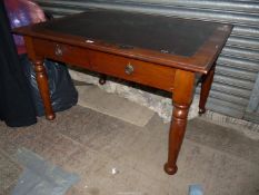 A Mahogany Library Table having a pair of frieze drawers,