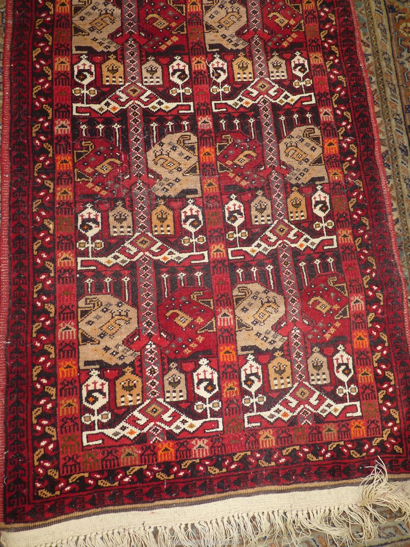 A border pattern and fringed Afghan tribal rug in bright and warm shades of terracotta, 58'' x 29''. - Image 2 of 3