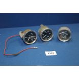 Three Smiths dashboard gauges for 2'' diameter recesses including 'Amps',