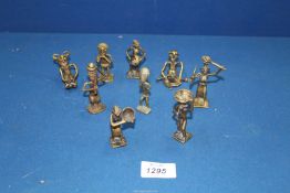 A group of nine early to mid 20th century Ashanti/Akan bronze weight figures.
