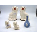 A small pair of Beswick mantle Spaniels, 3 1/2" high and a larger pair of Spaniels 9" high,