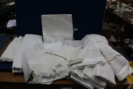 A quantity of linen including five linen sheets, two being embroidered, white embroidered bedspread,