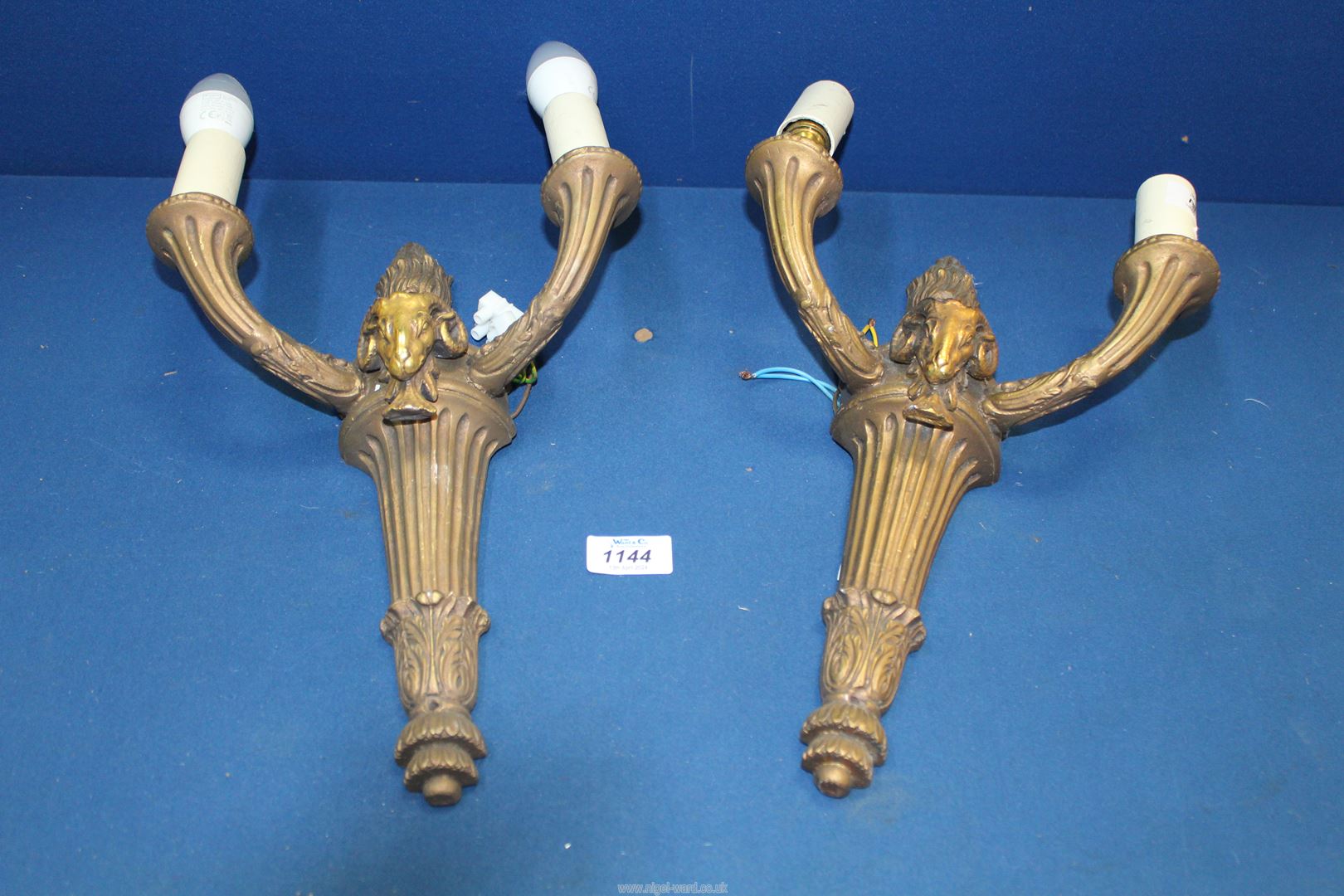 A pair of Empire style two branch wall lights.