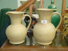 Two large Moira Pottery Hillstonia jugs, 9 1/2" and 10 1/4" tall.