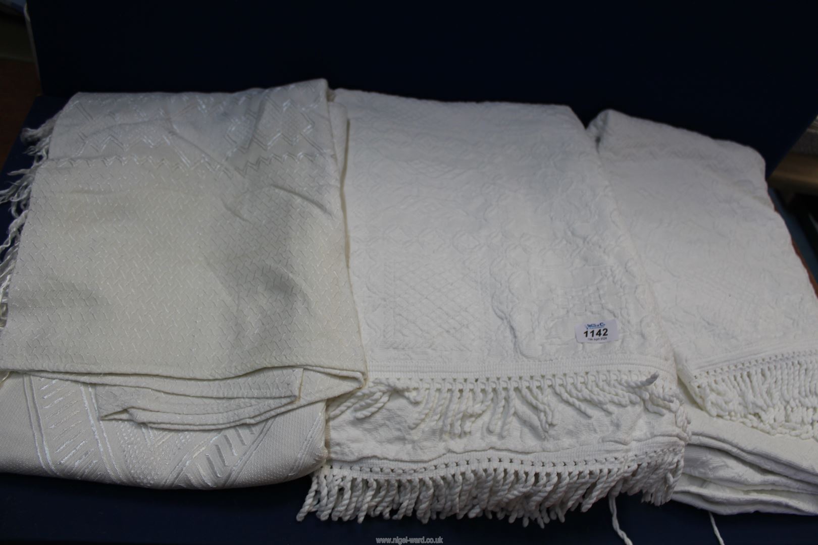 Three antique white cotton bed spreads.