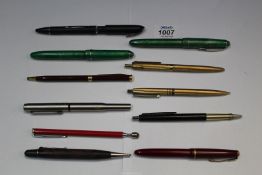 A quantity of pens including Osmiroid fountain pen, Parker with 14K gold nib, etc.
