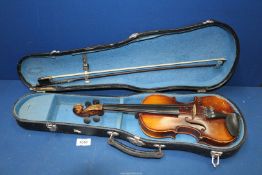 A cased 1/4 size Violin with bow.