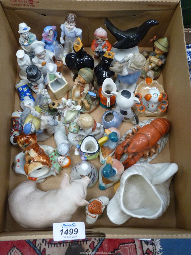 A quantity of small china ornaments including Goebel, Sylvac, Aynsley, pie funnels etc.