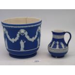 A large 19th century Wedgwood dark blue Jasperware Planter having classical scenes and swag