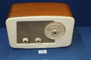 A vintage PYE bakelite and veneered Radio, 12'' wide x 7 1/2'' high.