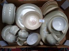 A quantity of Denby stoneware to include; plates, cups & saucers, serving dish, etc.