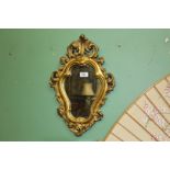 An ornate Gesso wall mirror, 18 1/2" x 12 1/2".