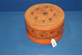 A circa 1900 Burmese Bagan red lacquered round Betel Nut box, 7 1/2'' diameter x 4'' high. a/f.