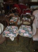 An unusual set of four bedroom style Dining Chairs having inlaid floral detail to the back rests,