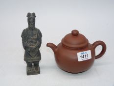 A small Chinese unglazed earthenware teapot, impressed stamp to base,