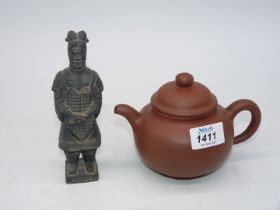 A small Chinese unglazed earthenware teapot, impressed stamp to base,