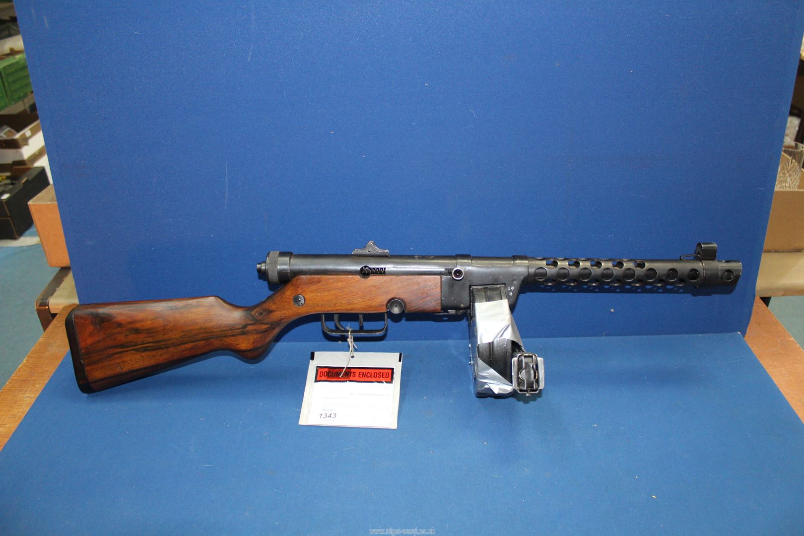 A post WWII M49 submachine gun with ventilated barrel to protect the operator during rapid fire,