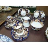 A Royal Albert part tea service in blue, orange, white and gilt to include; twelve cups,