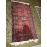 A Louis de Poortere Massoni carpet in earthy tones having a border pattern of small guls and two