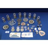 A quantity of cycling club handlebar Badges, badge moulds, RAC and MG car badges.