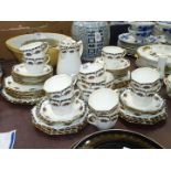 A large Delphine china tea service, octagonal shaped with raised swags of fruit,