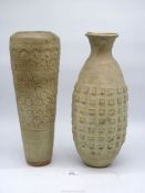 Two heavy and tall Studio Pottery vases, one with honeycomb design, the other with squares.