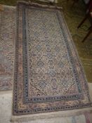 A border pattern and fringe rug in mixed colours of blue, pink, beige,