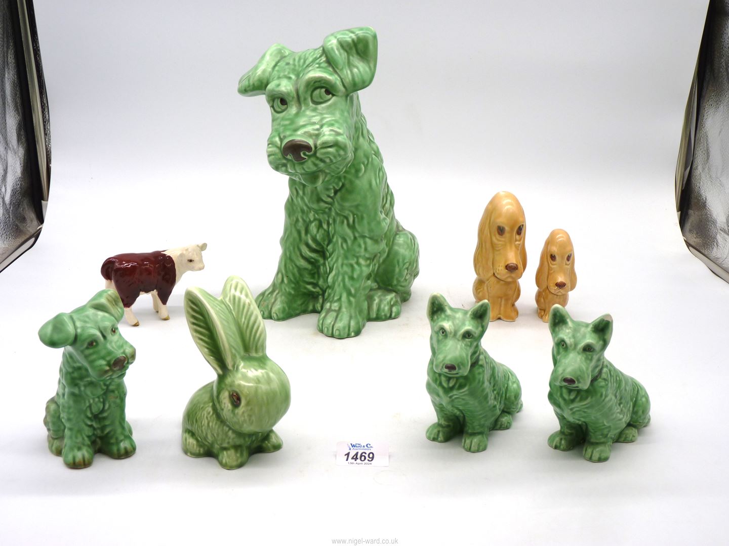 A small quantity of Sylvac dogs plus one rabbit (mostly green), plus a Beswick Hereford calf.