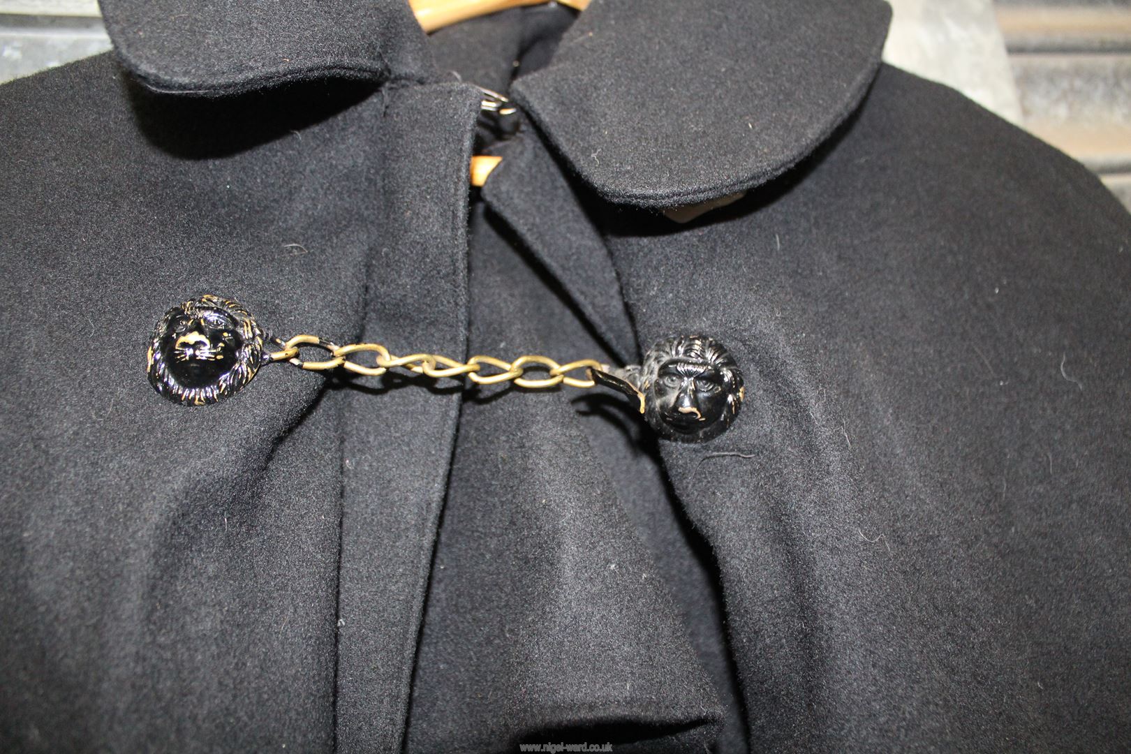 A large black woolen Cloak, possibly clerical, having mask lion button and chain fastening, - Image 2 of 3