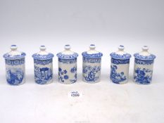 Six classic Spode blue and white spice jars in various patterns, 4 1/4" tall approx.