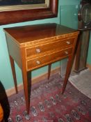 An elegant Boxwood beaded Mahogany Side Table standing on tapering square legs and having a pair of