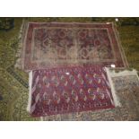 A small rug with Elephant footprint pattern in red and cream together with a Prayer rug (badly