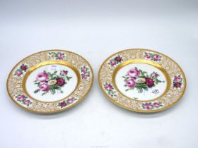 A pair of large Dresden hand painted cabinet plates of roses and butterflies,