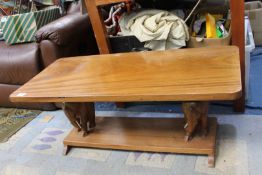 A Coffee table with two carved elephants to base, 3' long x 16" wide x 15" high.