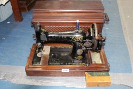 A hand operated Singer sewing machine no: 66, serial no: F8855289 - with shuttle bobbin,