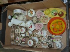 A quantity of china ornaments including Wedgwood, 'Clio' dressing table set, clocks, bells, roses,